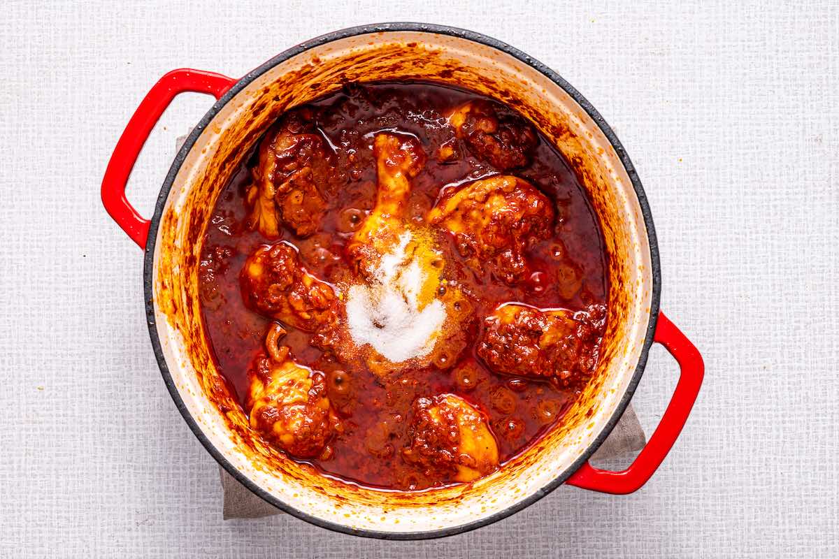 curry paste, cream, and chicken in Dutch oven.