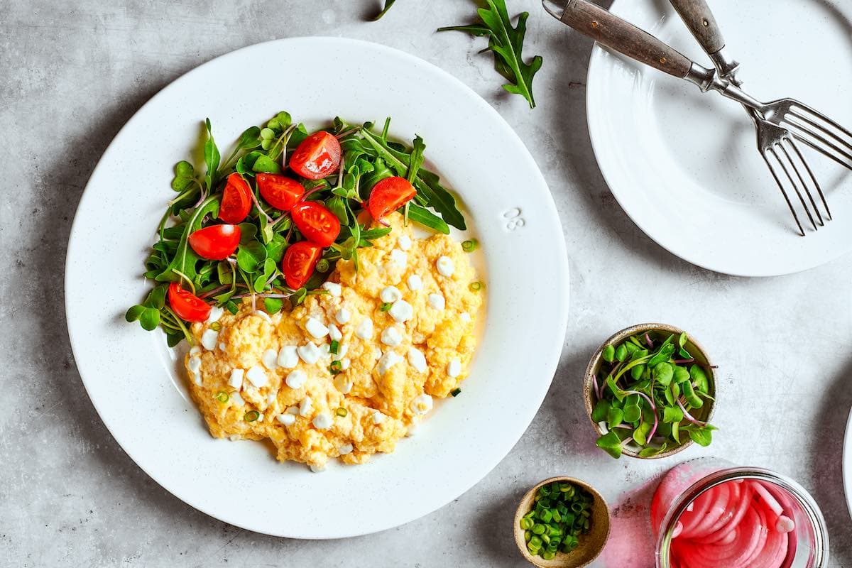 cooked cottage cheese eggs with salad.