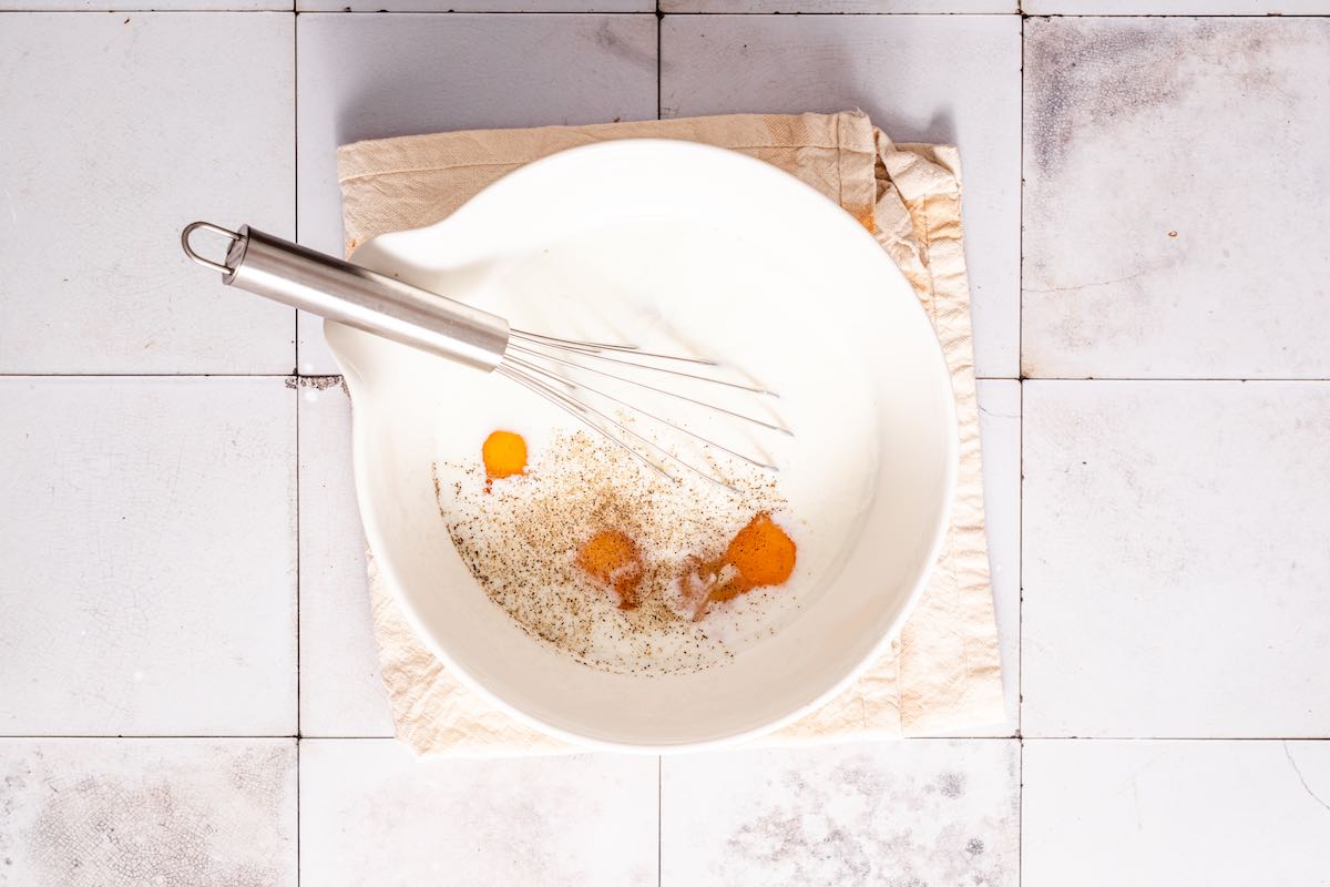 eggs and cream in a mixing bowl.