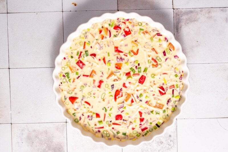 vegetables and egg mixture in baking dish.