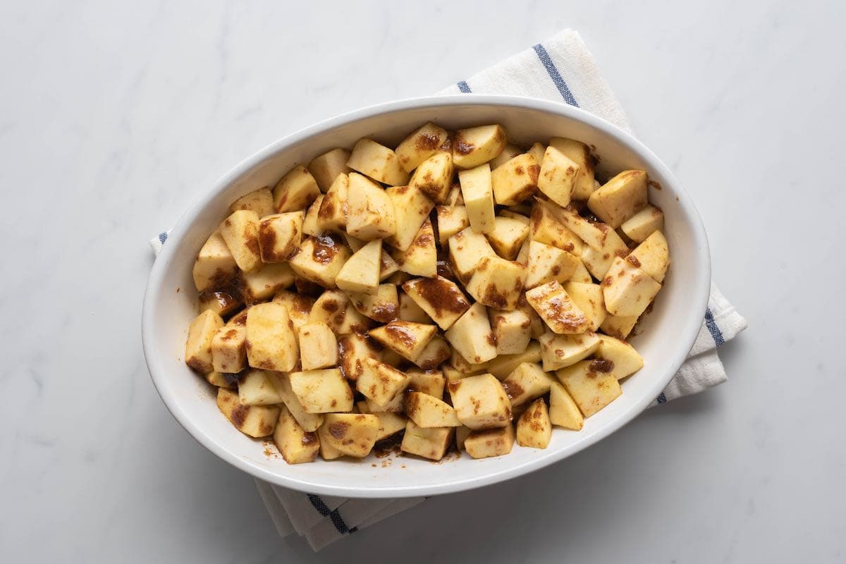 chopped apples in a baking dish.