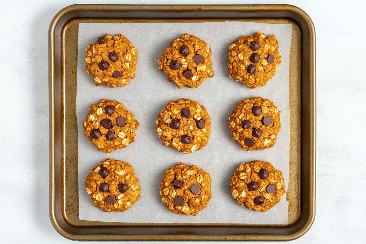 un-baked pumpkin cookies on a baking sheet.