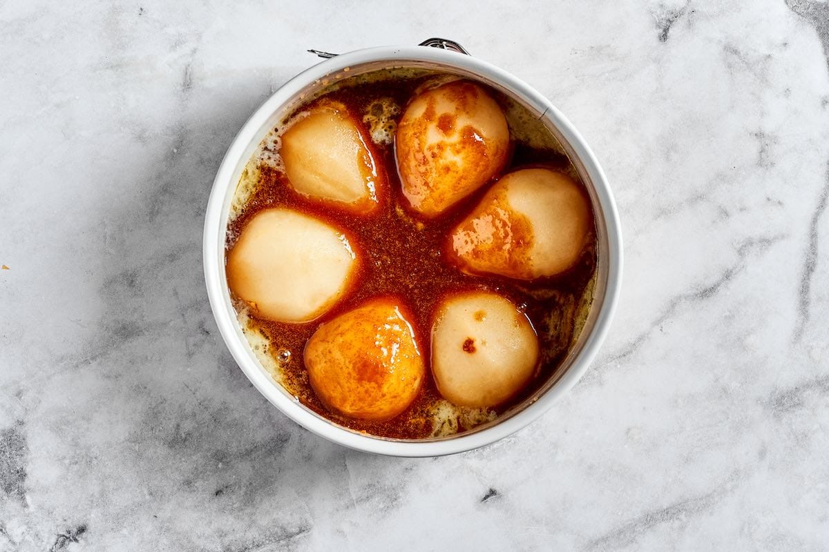 caramelized topping with pear halves on top.