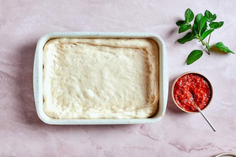 rolled out dough in rectangular pan.