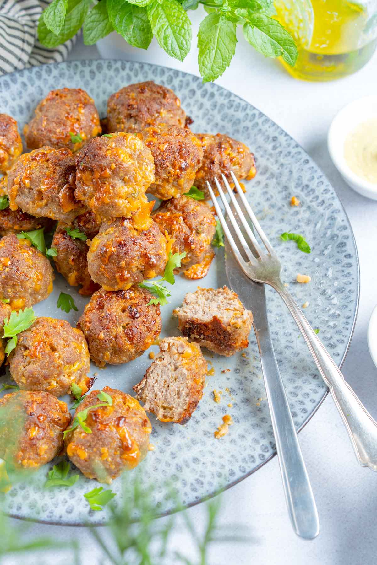 keto sausage balls on a plate.