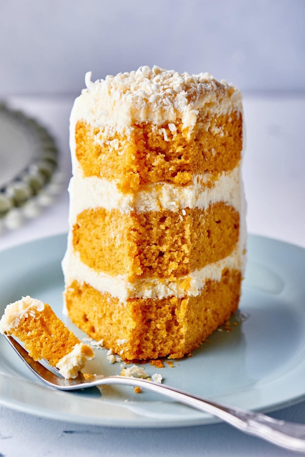 slice of pumpkin cake with frosting.