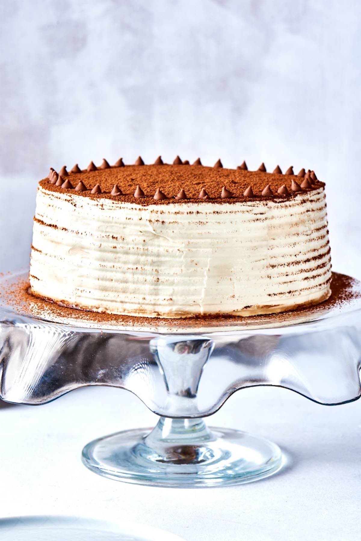 tiramisu cake on a cake stand.