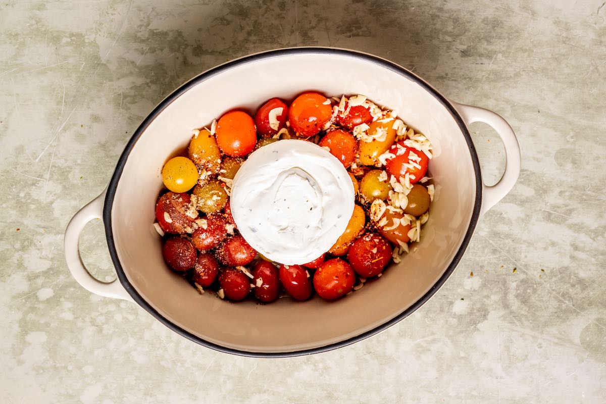 tomatoes and boursin cheese in a pot.