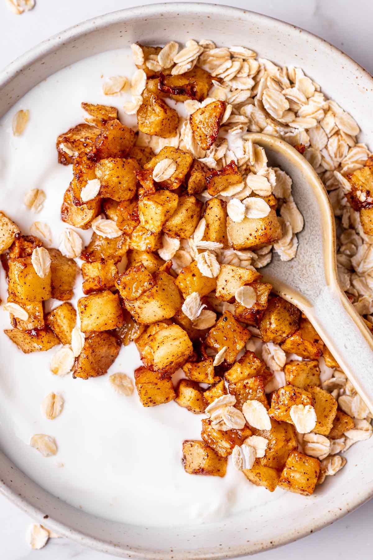 air fryer apples over yogurt with rolled oats.