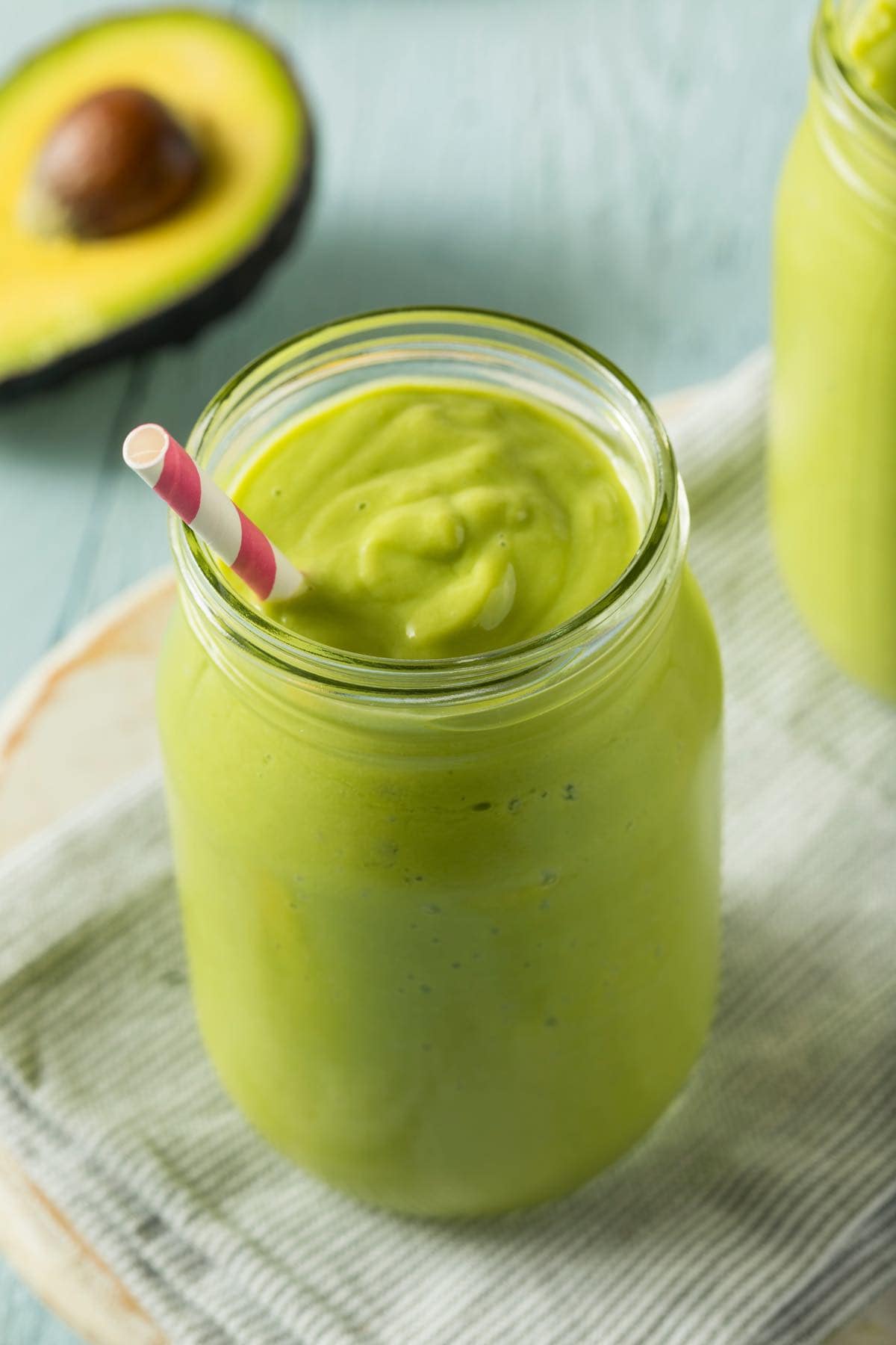 homemade avocado smoothie in a tall glass.