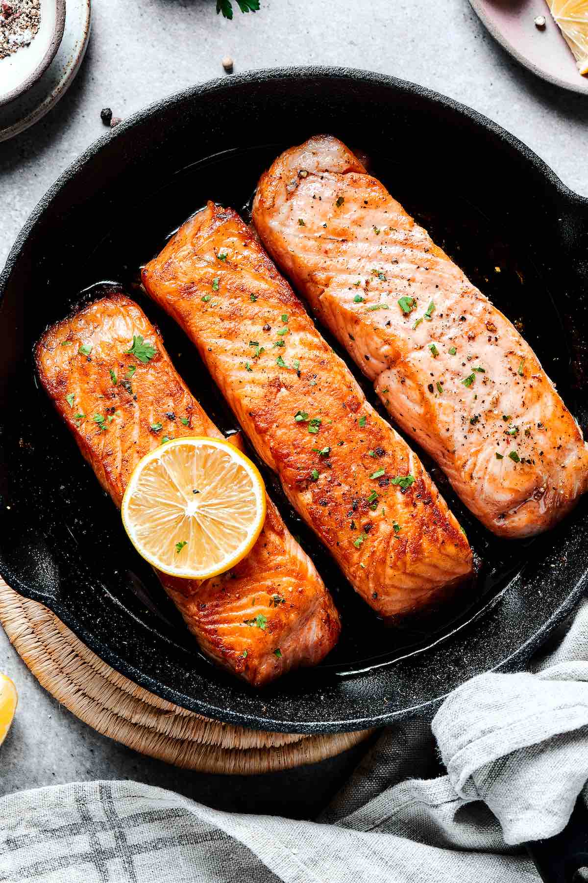 salmon fillets in a cast iron.