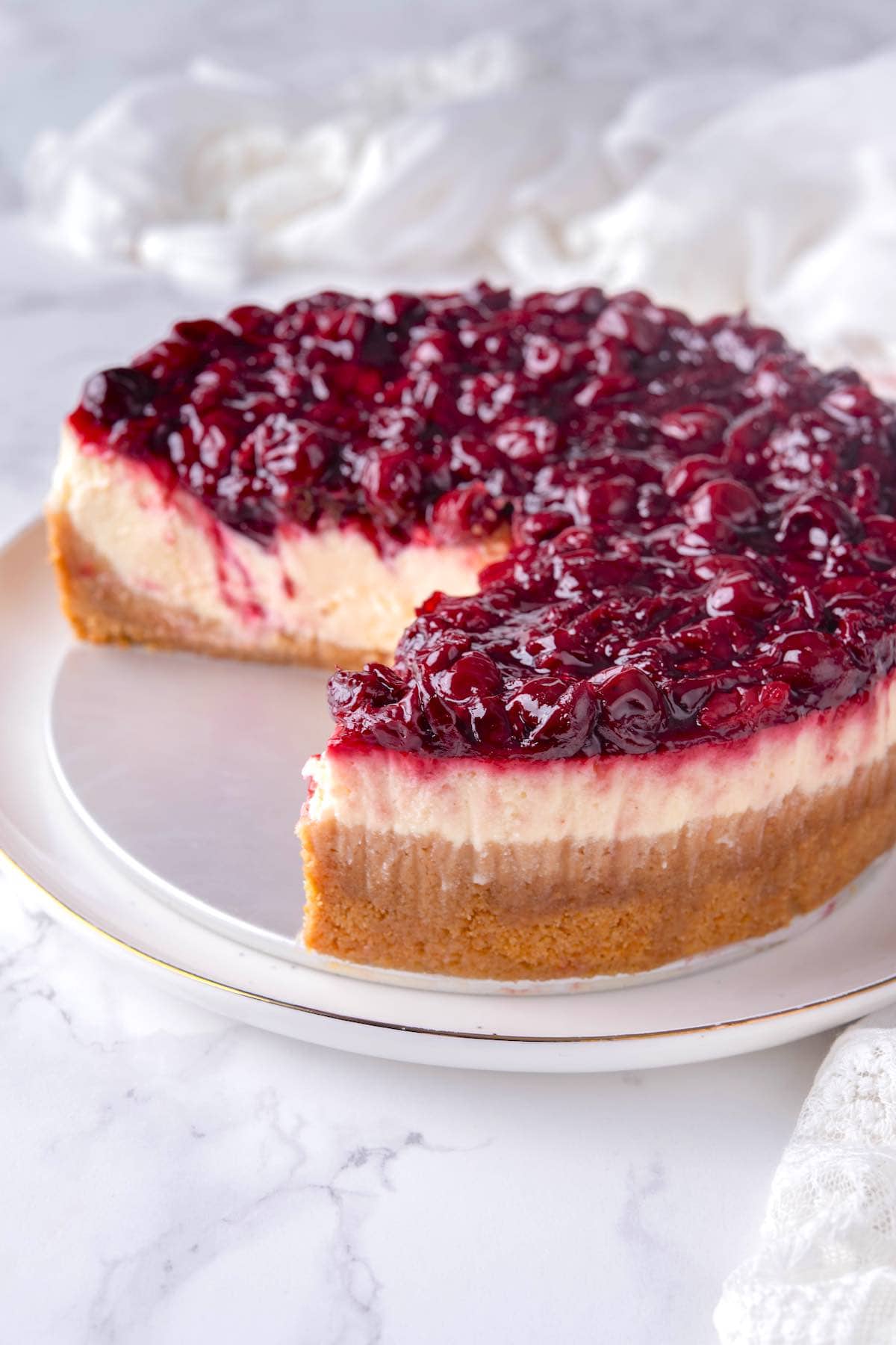 cherry cheesecake on a plate.