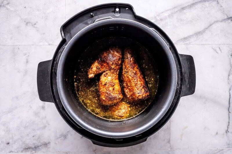 liquid mixture in the instant pot with the tenderloin.