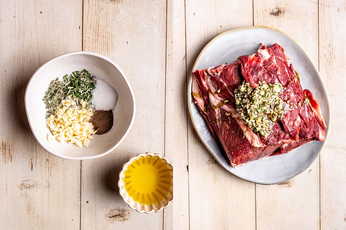 meat with herb mixture on a plate.