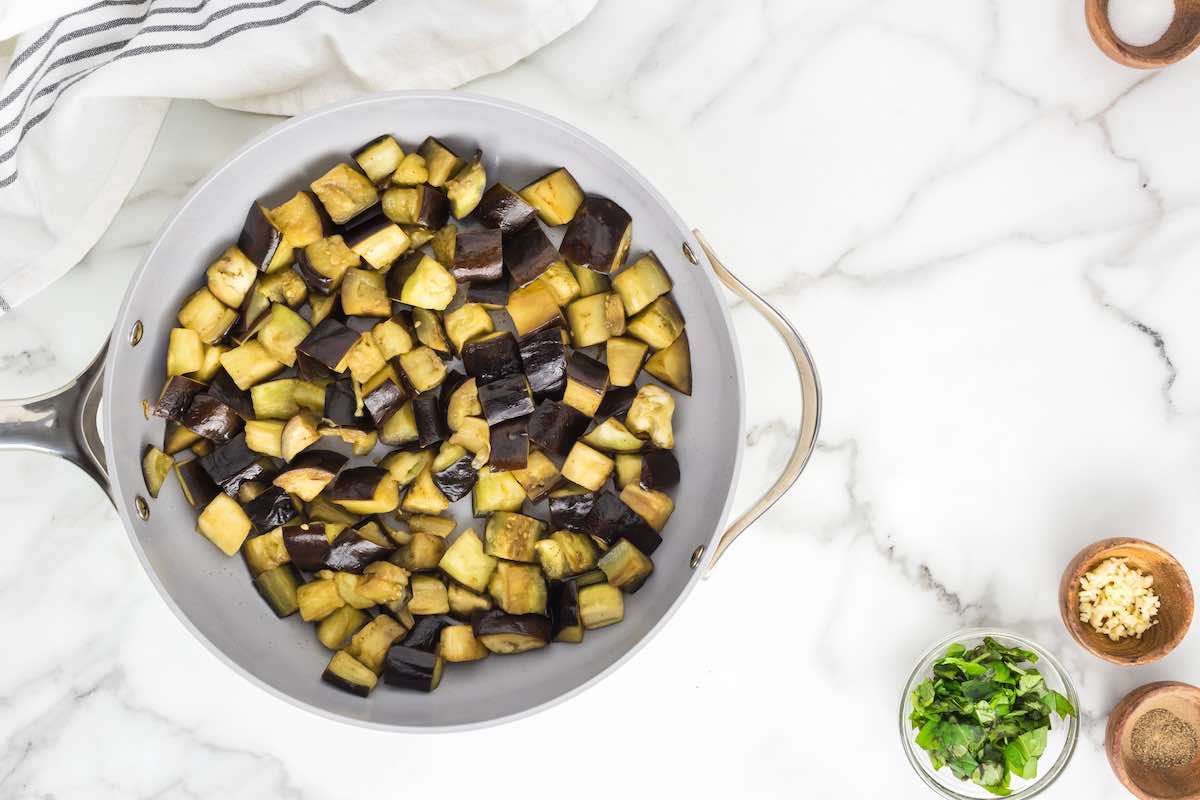 cooking eggplant in a skillet.