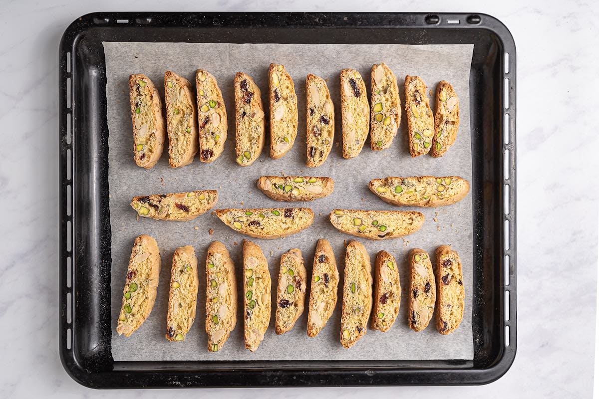 sliced biscotti on a baking sheet.