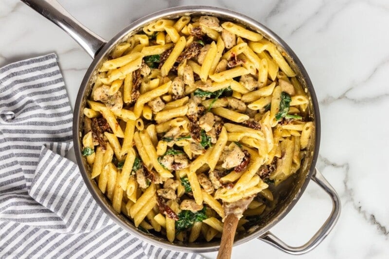 pasta combined with spinach, sun dried tomatoes, and seasoned chicken.