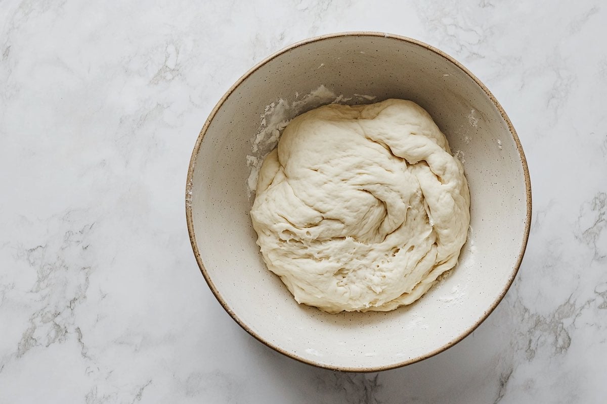 dough mixture featuring flour, yogurt, and sugar.