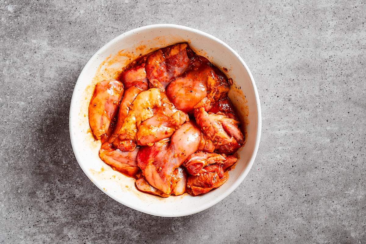 marinated chicken in a bowl.