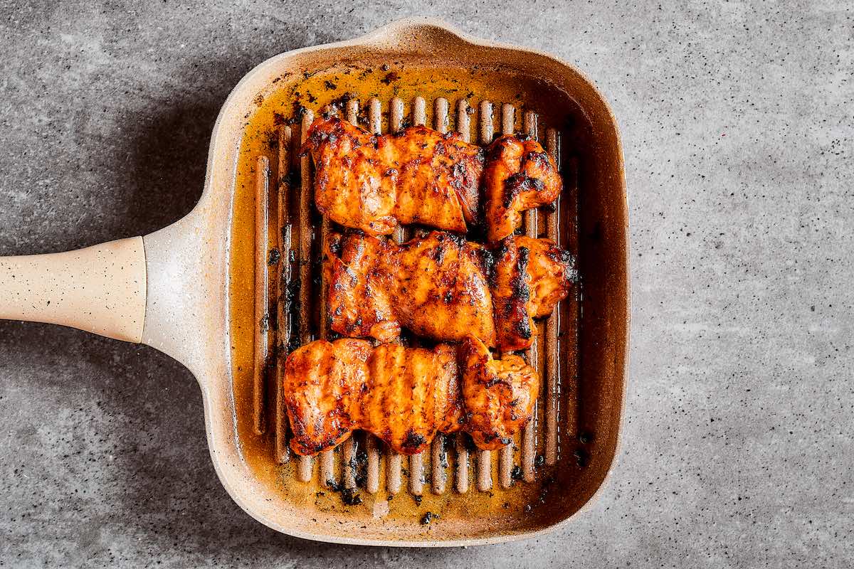 grilling chicken in a grill pan.