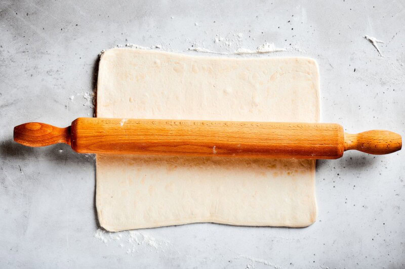 rolling out puff pastry.