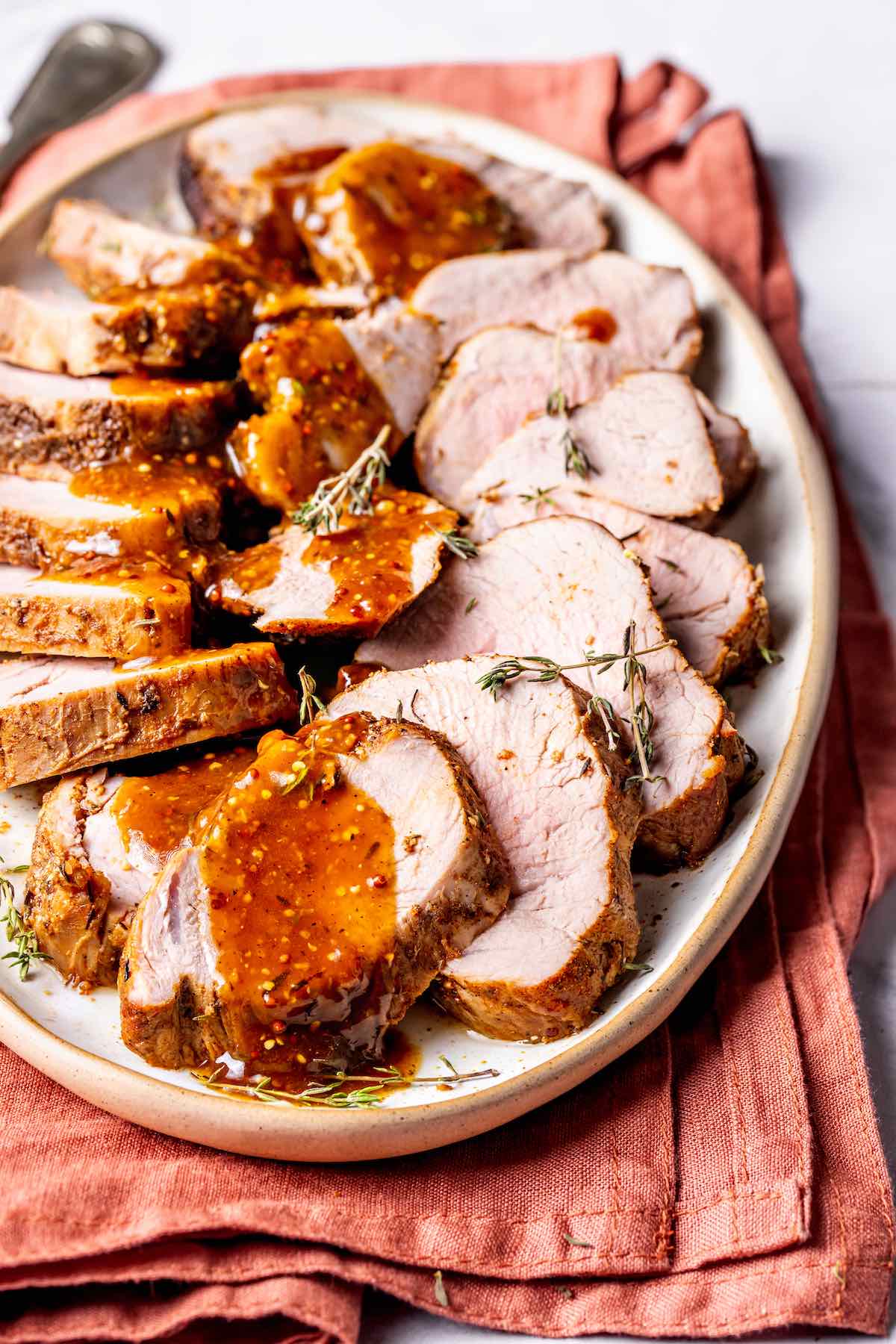 sliced instant pot pork tenderloin on a plate.