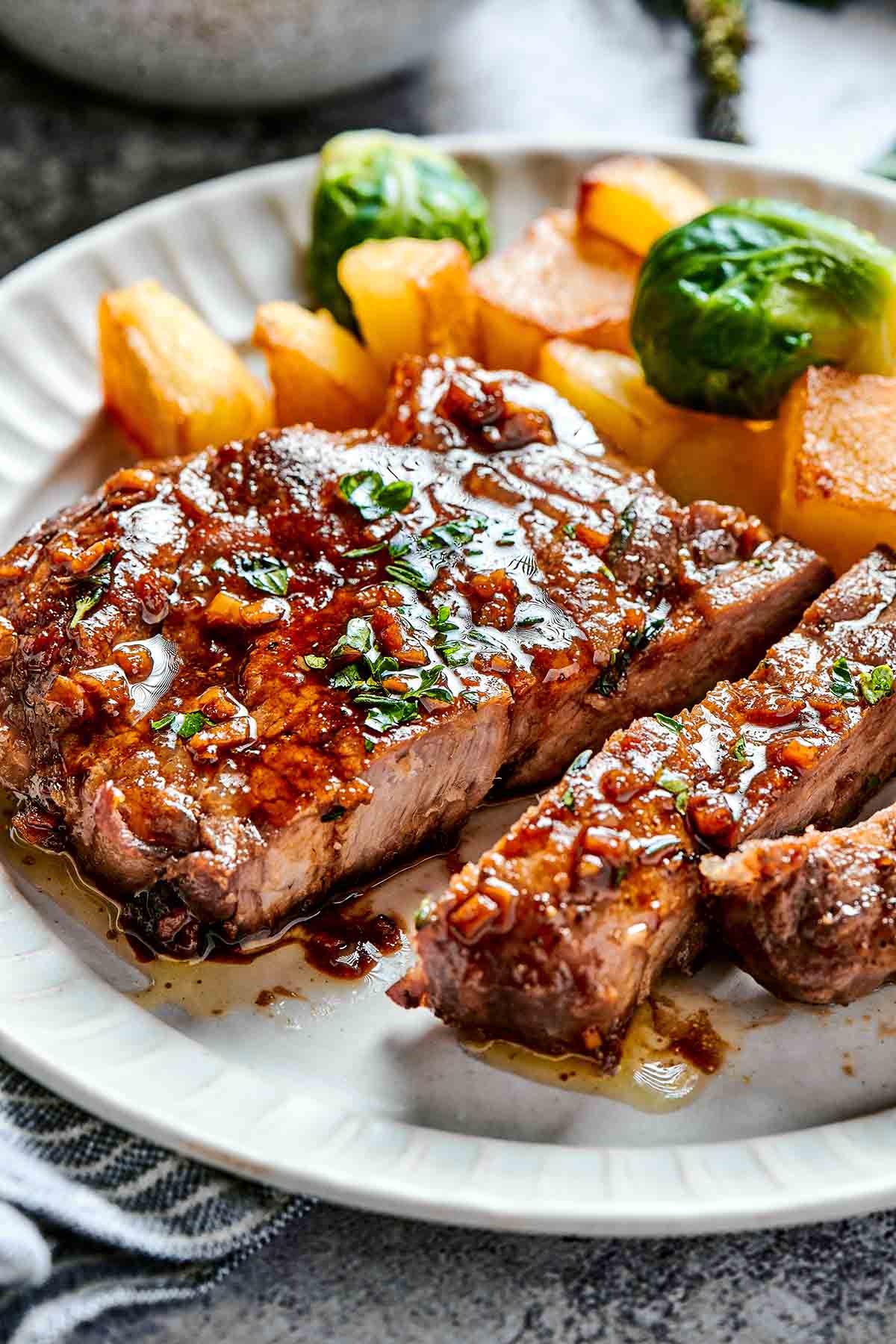 pork steaks with roasted potatoes with brussels sprouts.