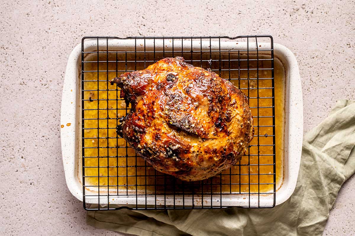 roasted pork shoulder on a wire rack.