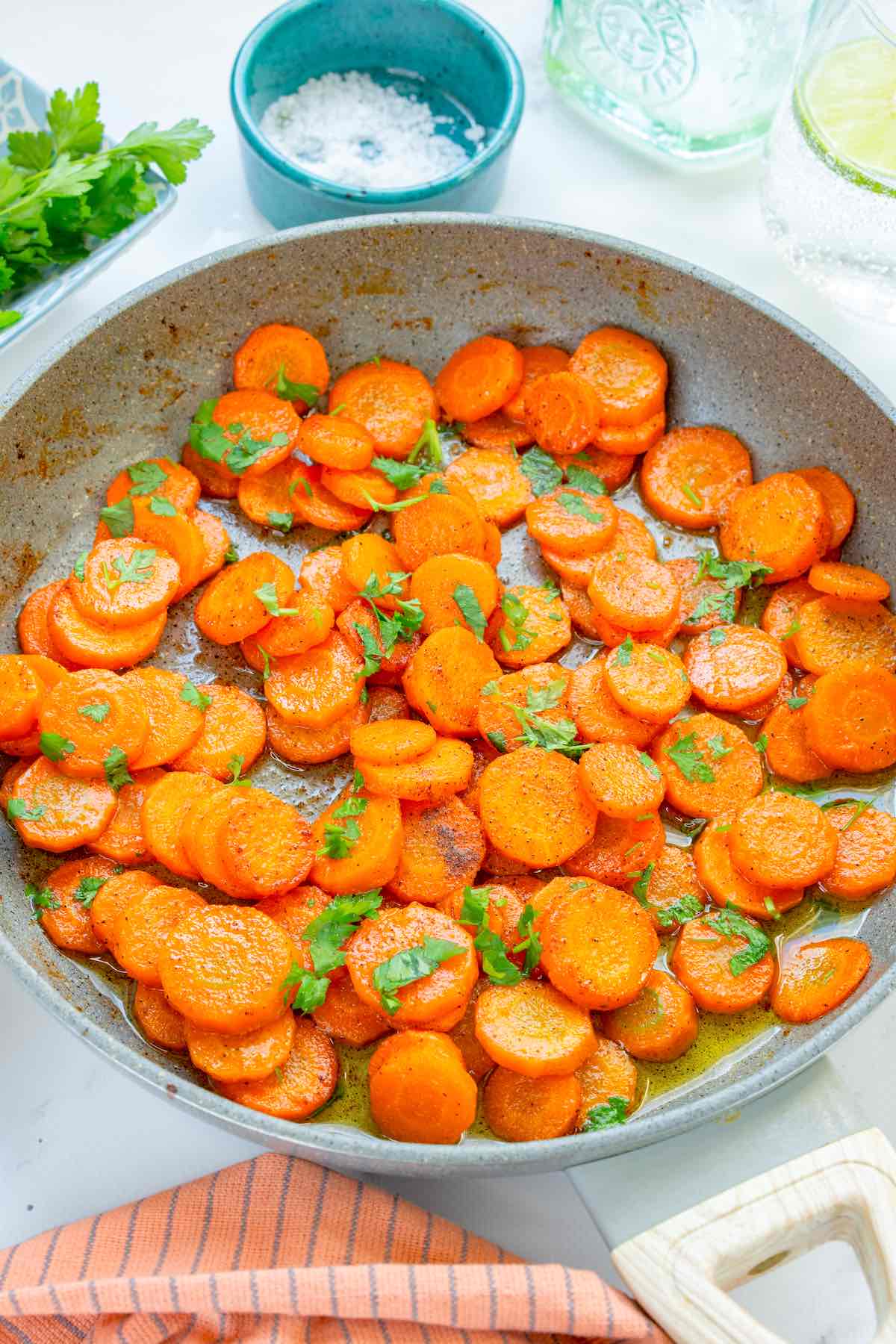 sauteed carrots in a skillet.