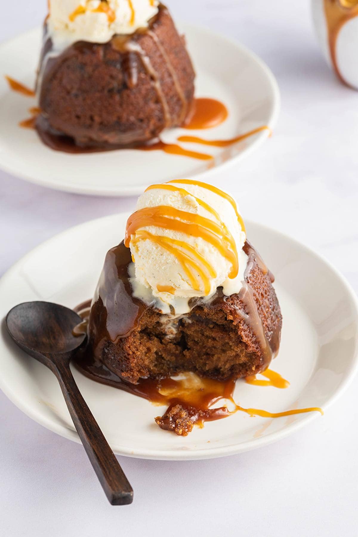 sticky date pudding with vanilla ice cream on top.