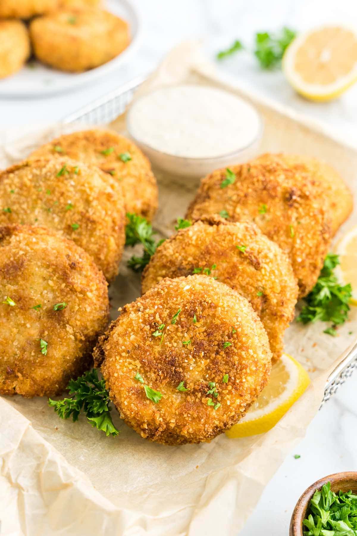 crispy tuna croquettes with chopped parsley.