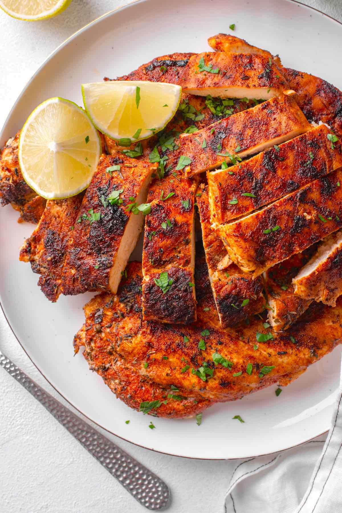 sliced blackened chicken on a plate.