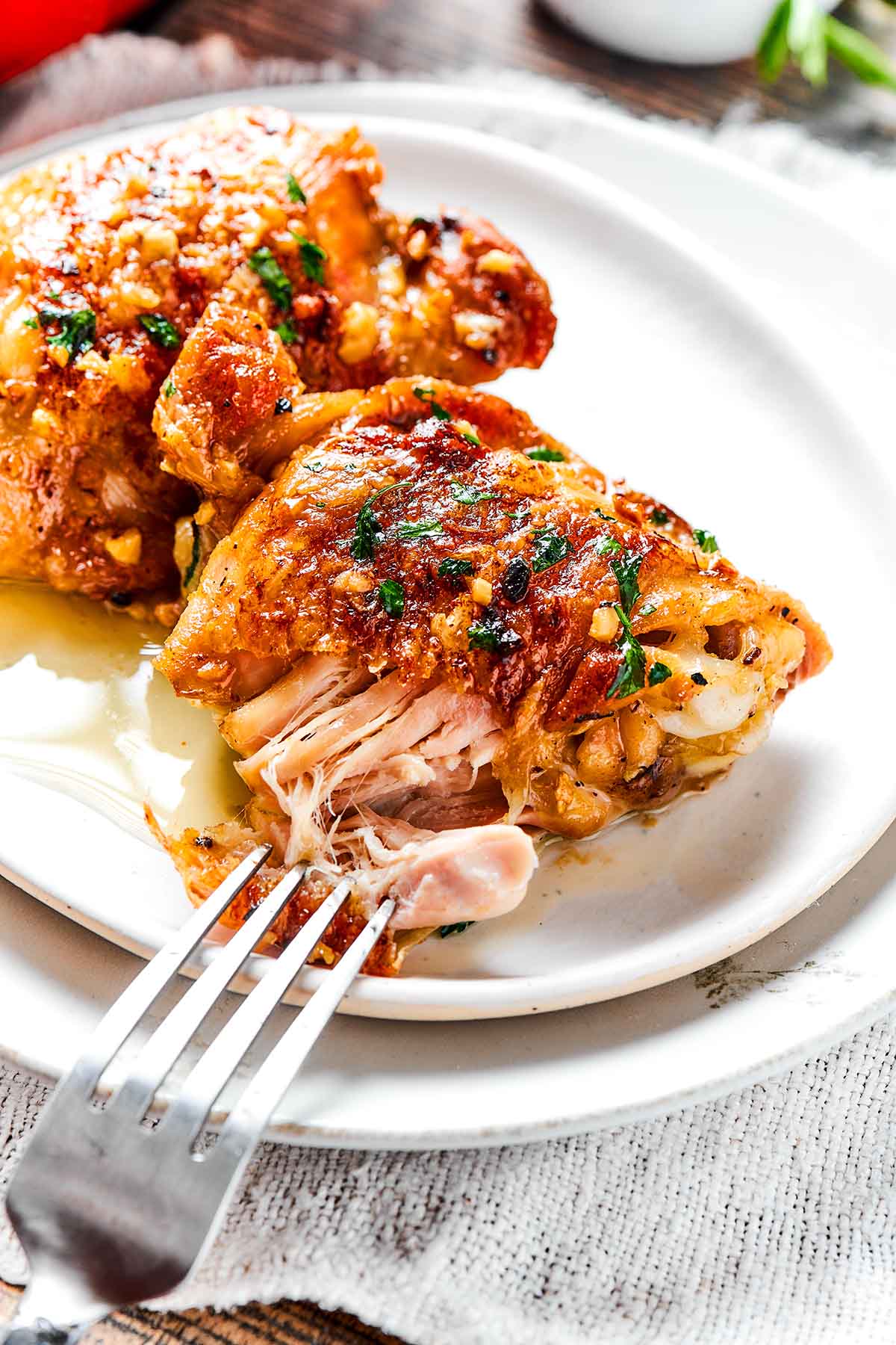 chicken thighs on a plate.