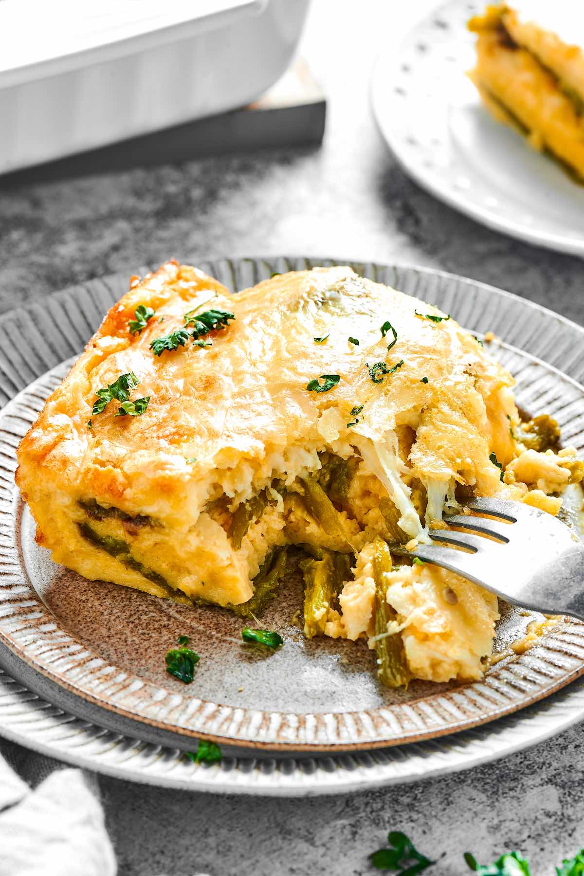 slice of chili relleno casserole on a plate.