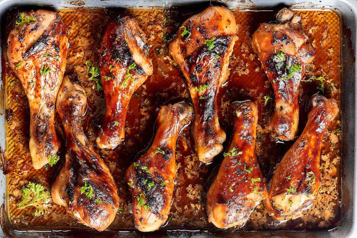 baked chicken legs on a baking dish.