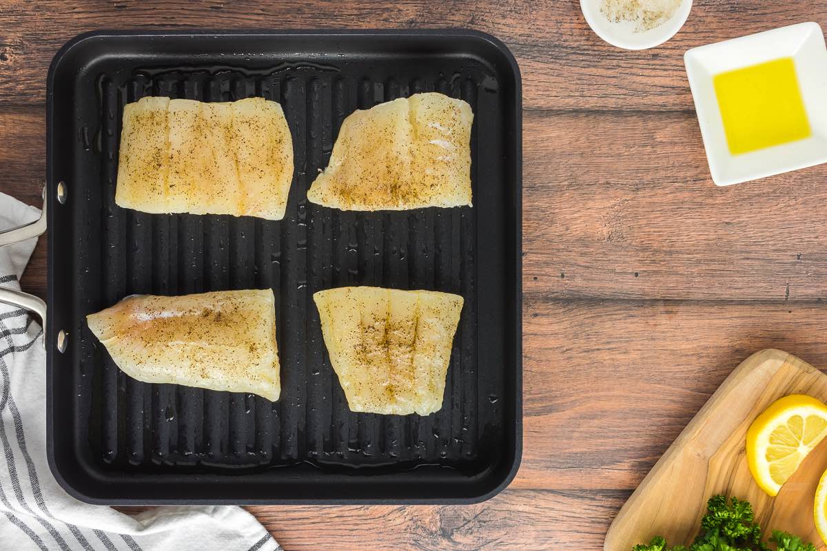 raw haddock fillets on the grill.