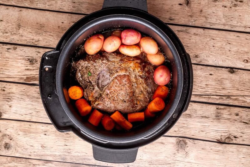 seared chuck roast with carrots and potatoes.