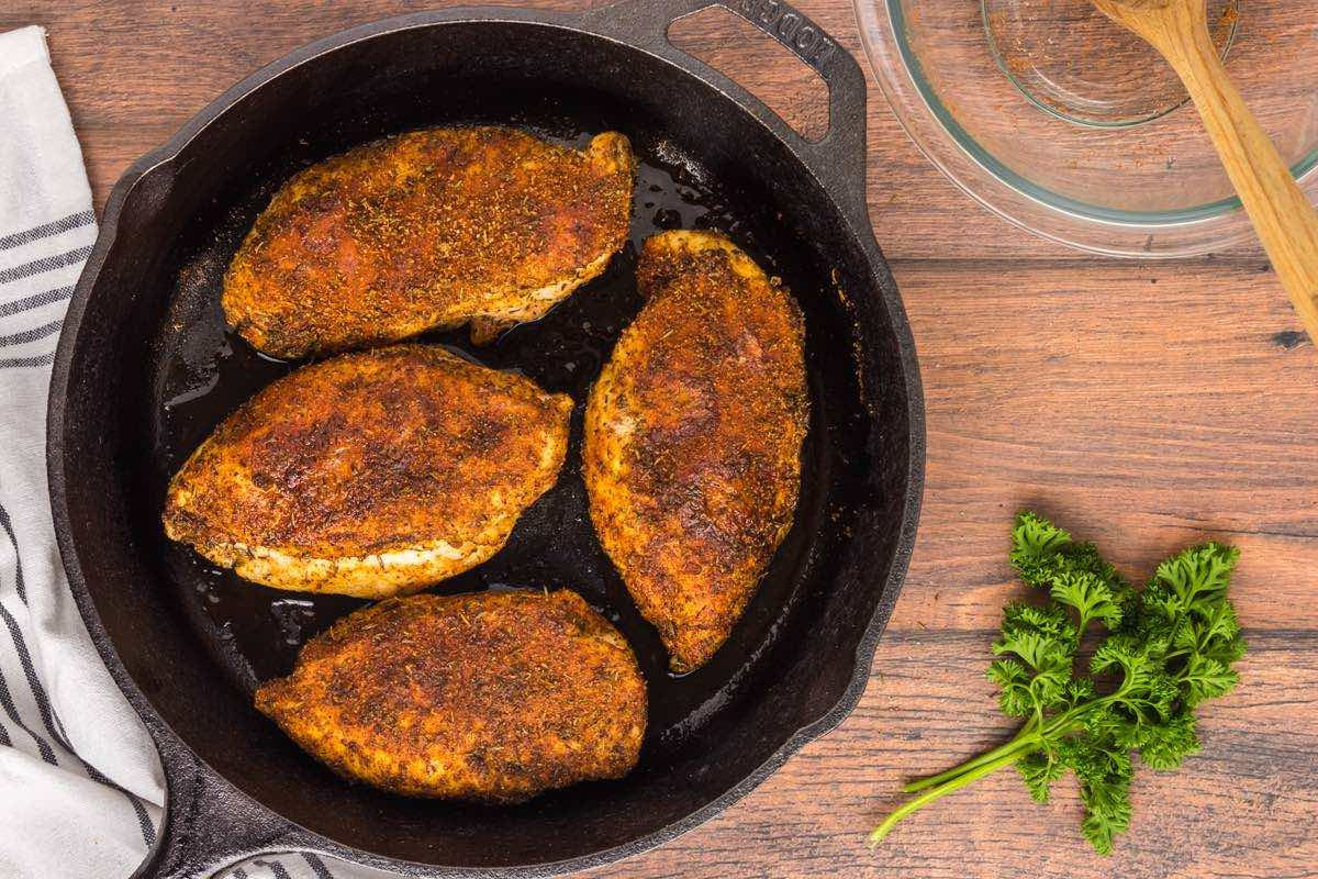 seared chicken breasts in a skillet.