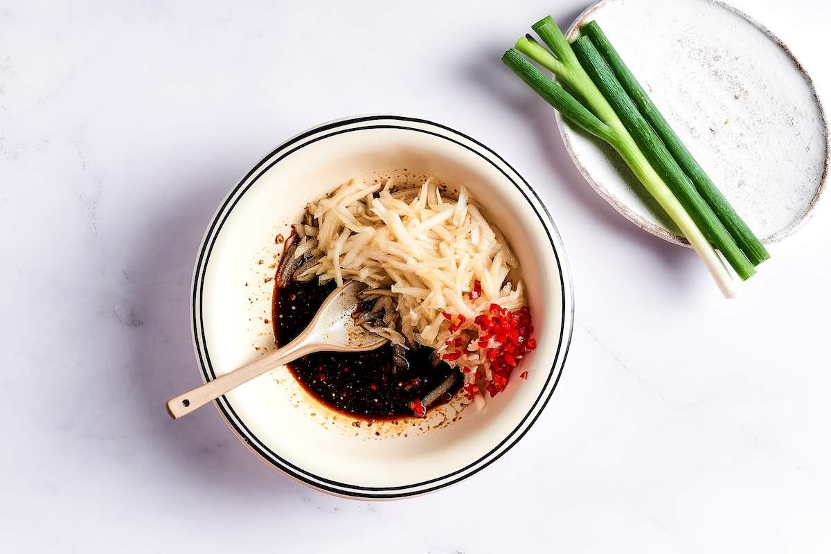 grated pear and gochujang in a bowl.