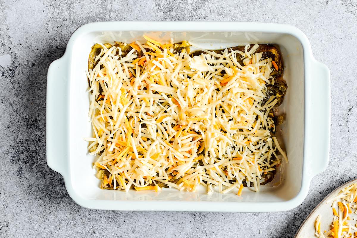 poblano peppers with shredded cheese on top.