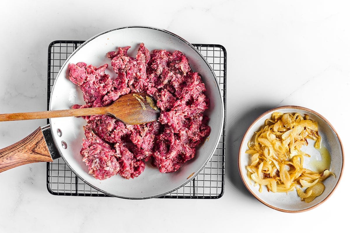 cooking ground beef in skillet.