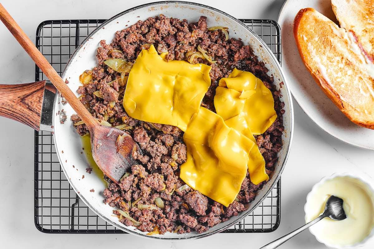 ground beef with cheese melted on top.