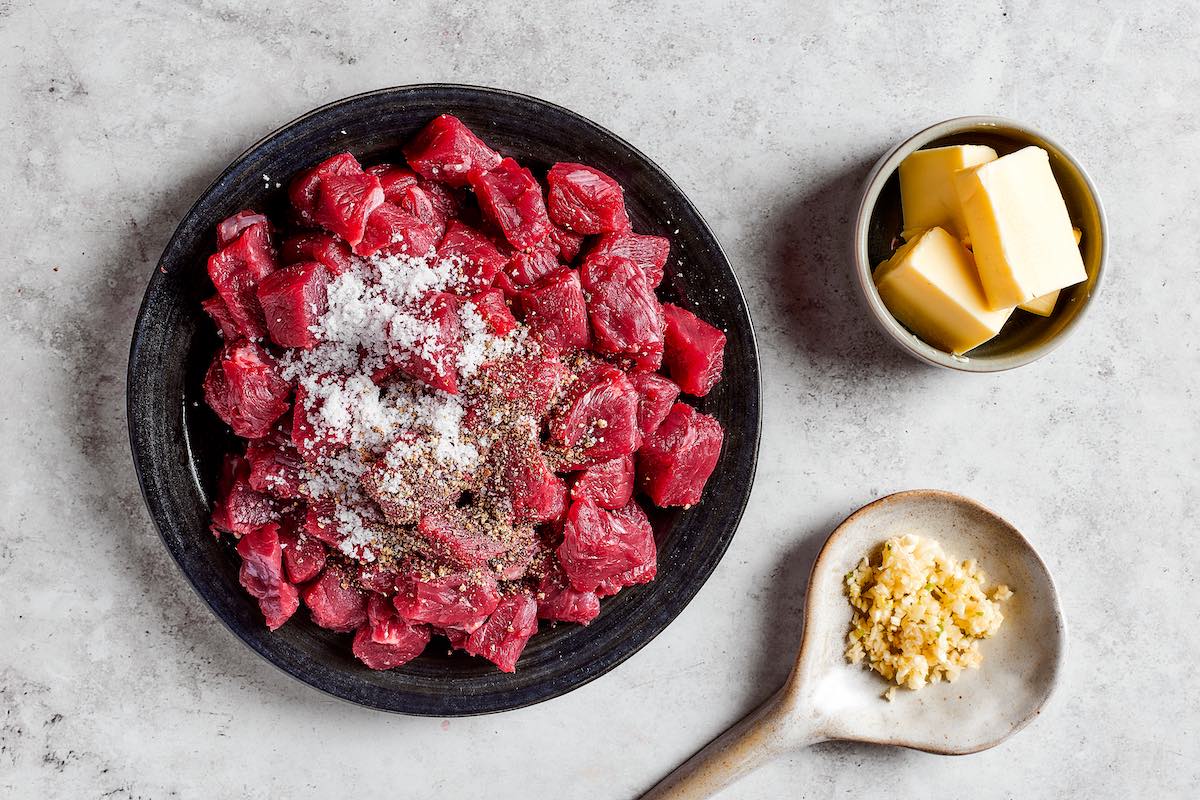 raw chopped steak with salt and pepper.