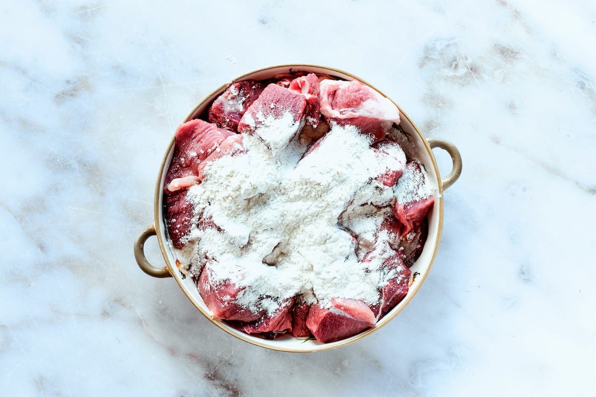 raw, diced pork with flour.