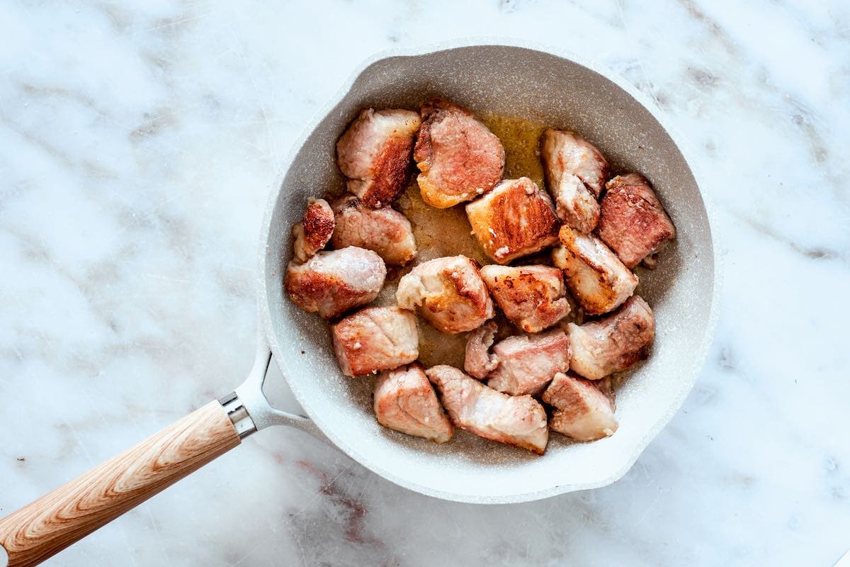 pan-seared pork in a skillet.