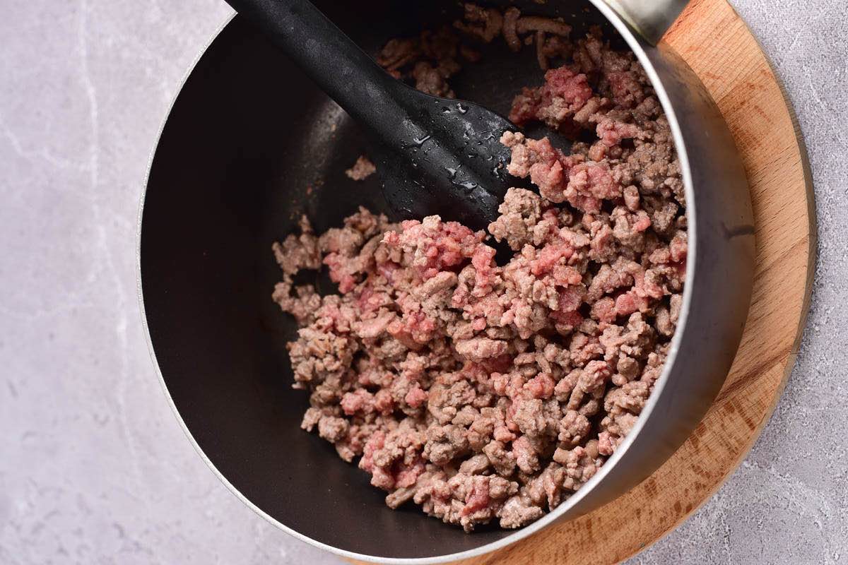 ground beef cooking in a pot.