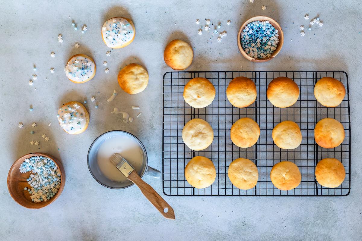 baked cookies with frosting on the side.