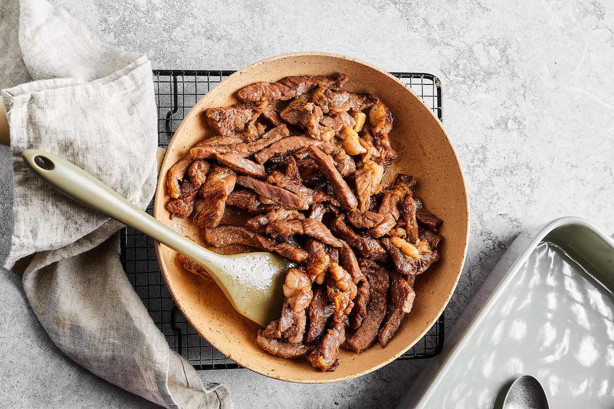 sauteed beef in skillet.