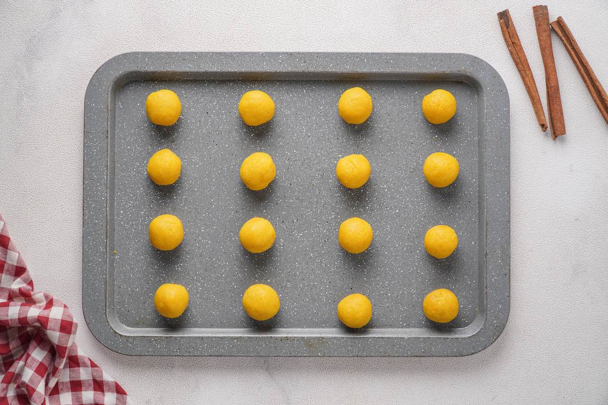 shaped cake balls on a baking sheet.