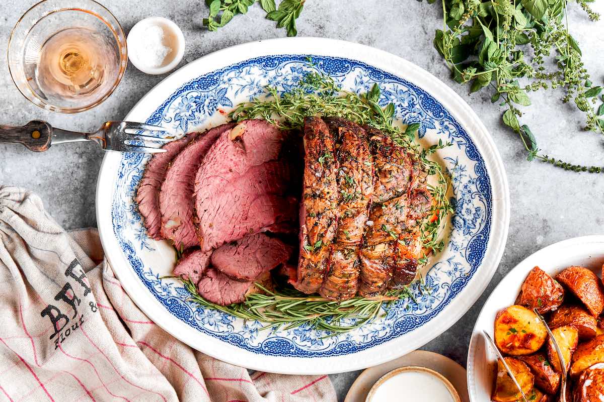 sliced beef on a serving plate.